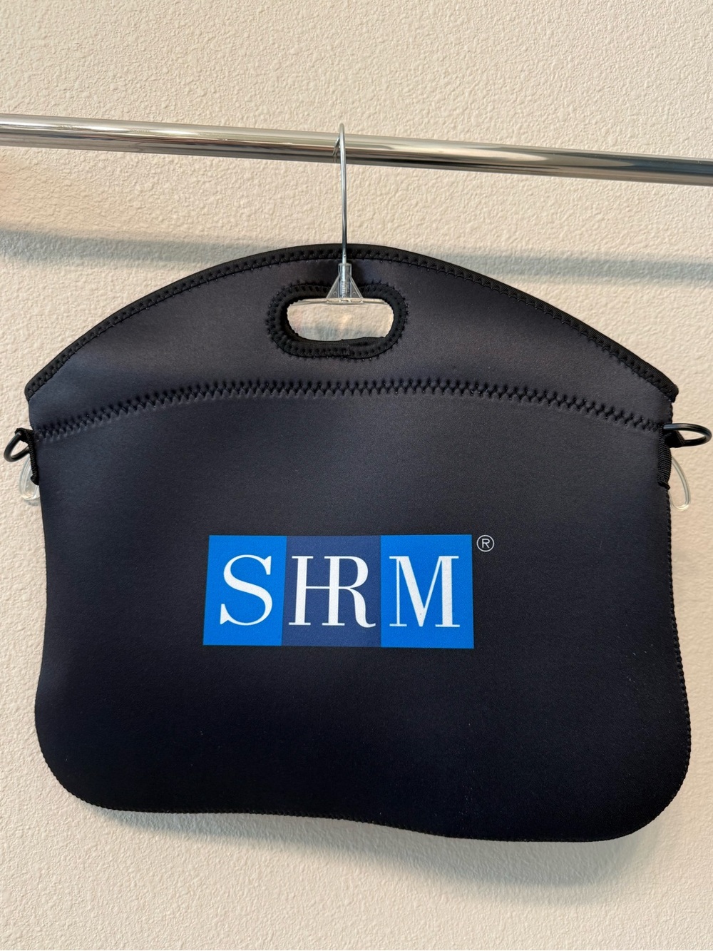 NWOT zippered black neoprene laptop bag with removable shoulder strap, SHRM logo